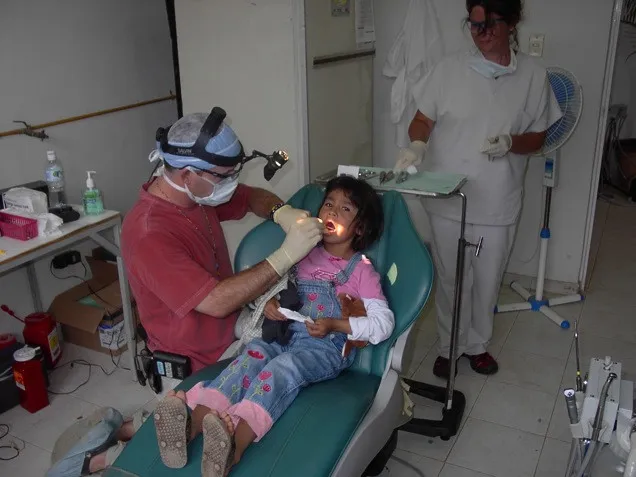 Dr. Peavy Checks Teeth at a Clinic in Mexico 2009